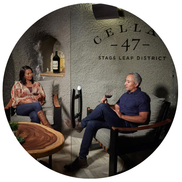 couple tasting wine in cave at Pine Ridge Vineyards
