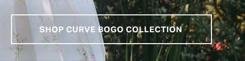 White 'SHOP CURVE BOGO COLLECTION' text on a banner over a romantic floral fabric and vibrant green foliage, encouraging browsing the special plus-size sale.