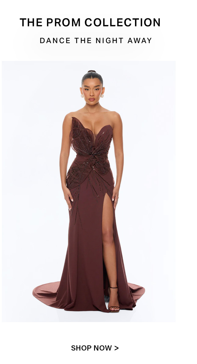 Model in a stunning auburn strapless prom gown with a beaded bodice, sweetheart neckline, and high slit, promoting the Prom Collection.