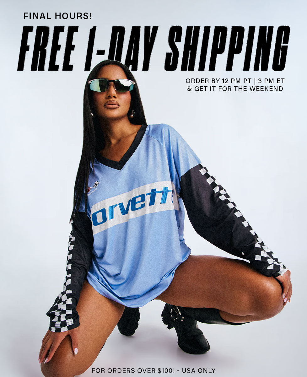 Final hours! FREE 1-DAY SHIPPING. Woman in "Corvette" racing jersey & shades. Order by 3 PM ET for weekend delivery for USA $100+ orders.