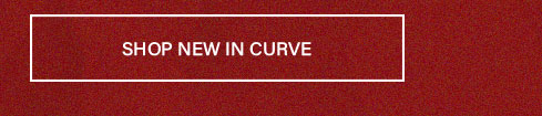 Dark red button with white text "SHOP NEW IN CURVE" and outline. Discover new fashion arrivals and stylish plus-size clothing today.