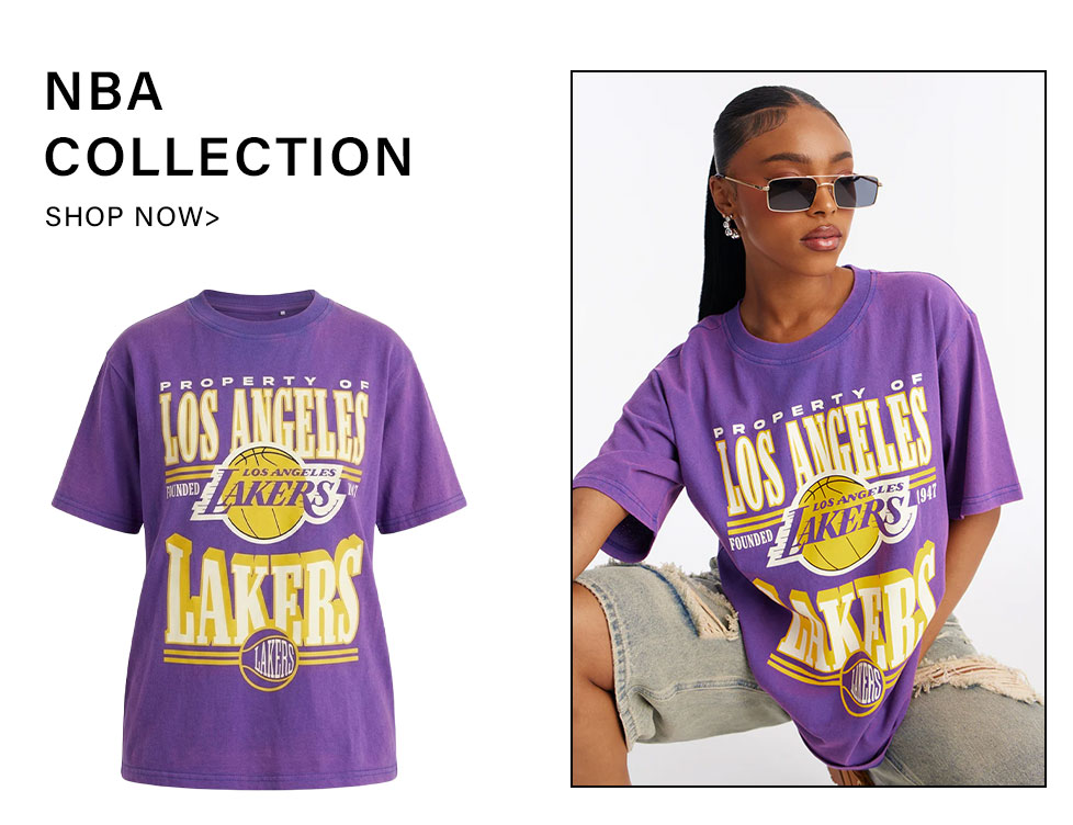 NBA Collection: Purple Los Angeles Lakers graphic t-shirt. Model wearing Lakers tee. Shop officially licensed NBA apparel now!