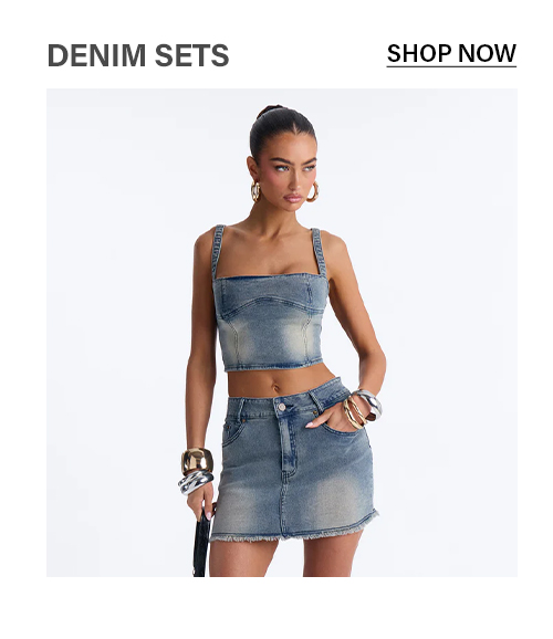 Woman in light wash denim crop top & frayed mini skirt set. Shop trendy women's two-piece denim outfits.