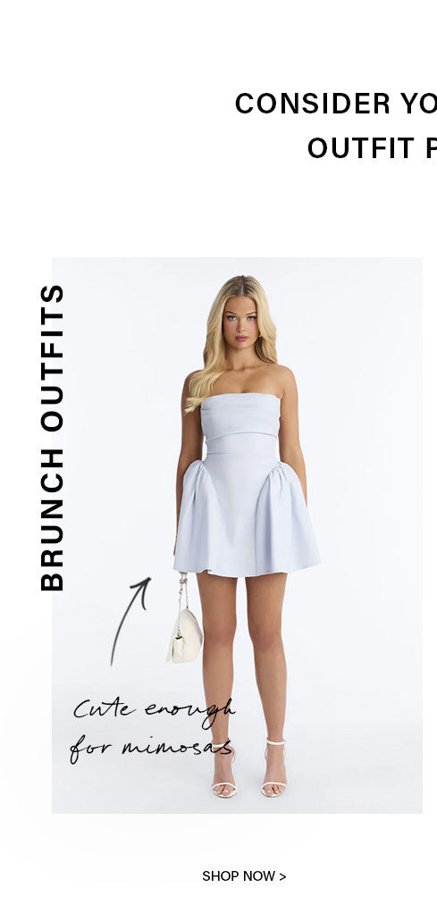 Blonde woman in a stylish light blue strapless mini dress with a full skirt, holding a white clutch. Perfect brunch outfit.