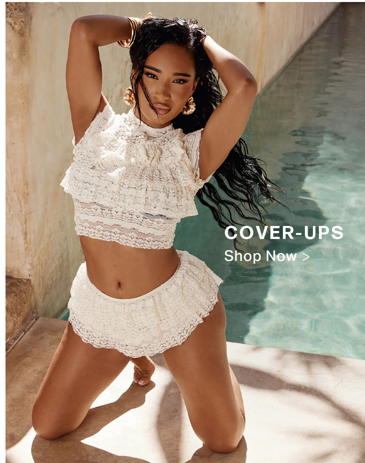 Woman kneeling poolside in a chic cream lace ruffle two-piece outfit. Explore our new collection of stylish cover-ups today!