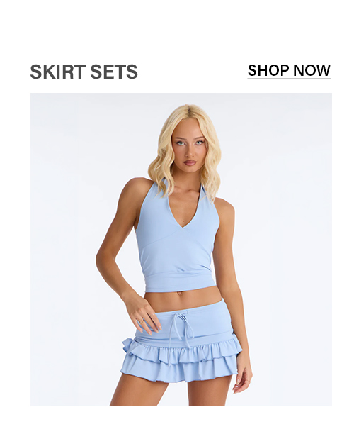 Light blue v-neck halter crop top & ruffled mini skirt set for women.