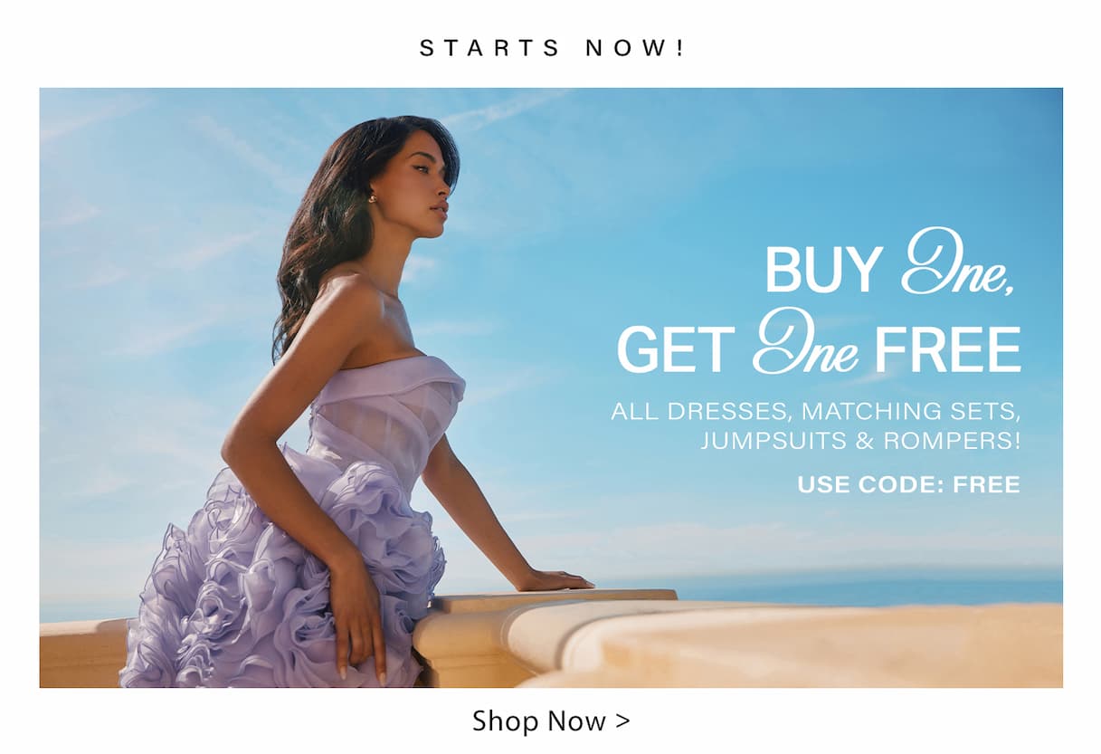 Woman in a lavender ruffled strapless dress on a balcony, blue sky. Promoting Buy One Get One FREE on dresses, sets, jumpsuits, rompers.