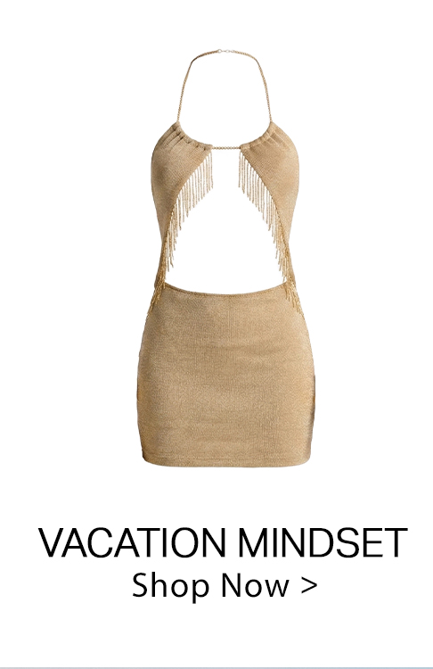 Shimmering gold metallic halter mini dress featuring a daring front cut-out and sparkling fringe accents. A stylish vacation or party dress.