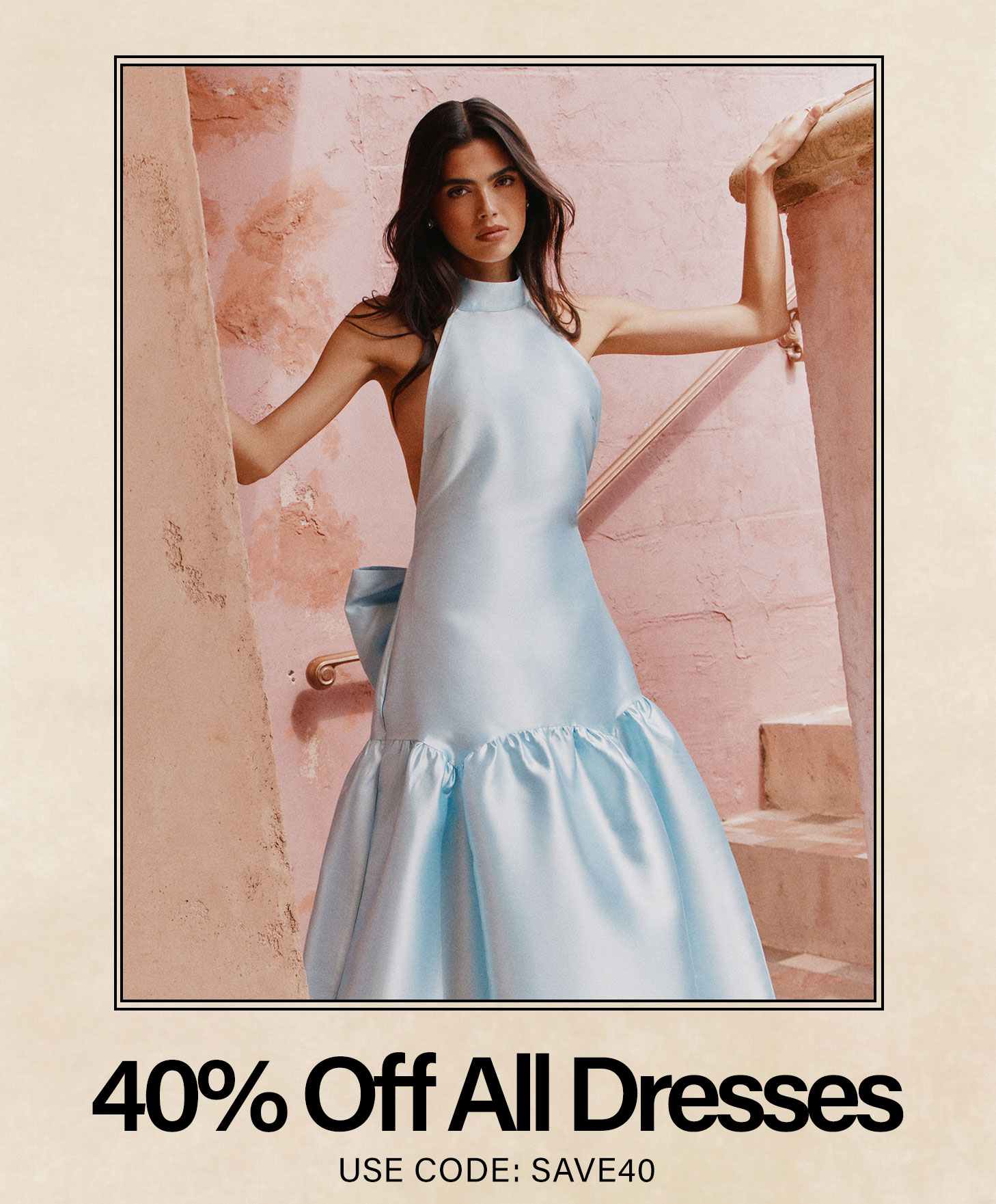 Light blue halter neck gown on woman. Get 40% off all dresses & gowns with code SAVE40.
