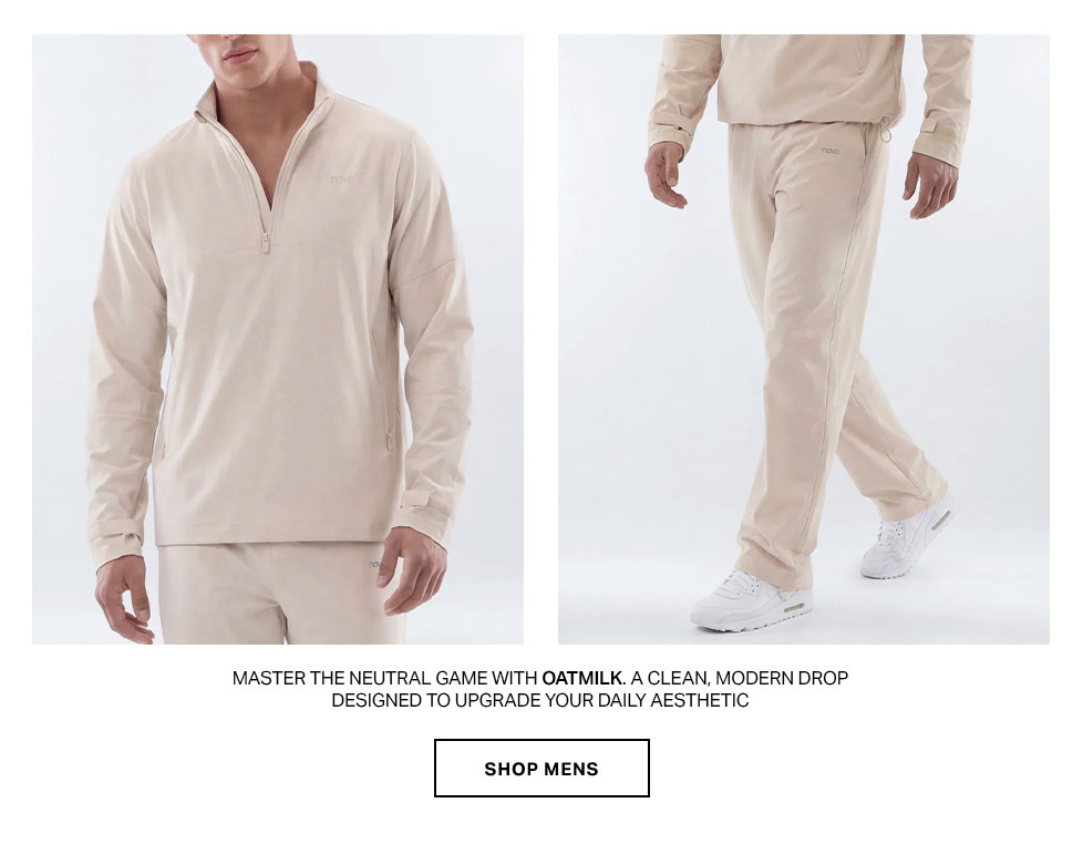 Man modeling a modern oatmilk neutral men's activewear set: a half-zip pullover top and matching joggers. Elevate your daily aesthetic.