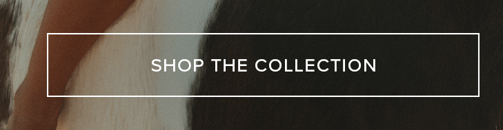 SHOP THE COLLECTION button over a soft, light brown textile and dark, textured background. Explore our new collection and discover unique styles.