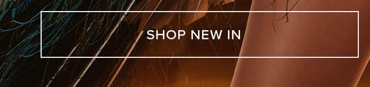 Abstract dark background with shimmering blue-green lines and warm brown texture. "SHOP NEW IN" button highlights latest fashion arrivals.