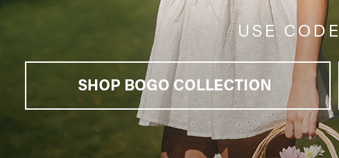 Woman in a white eyelet dress holds a wicker flower basket. Discover our BOGO collection & shop buy one get one free deals!