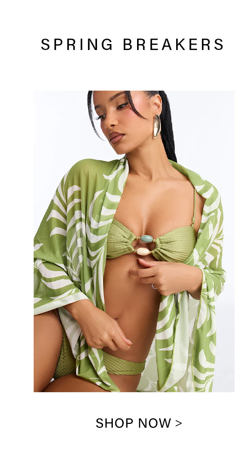 Stylish woman in a vibrant lime green textured bikini and flowy tropical leaf print kimono, promoting the new Spring Breakers collection. Shop now.