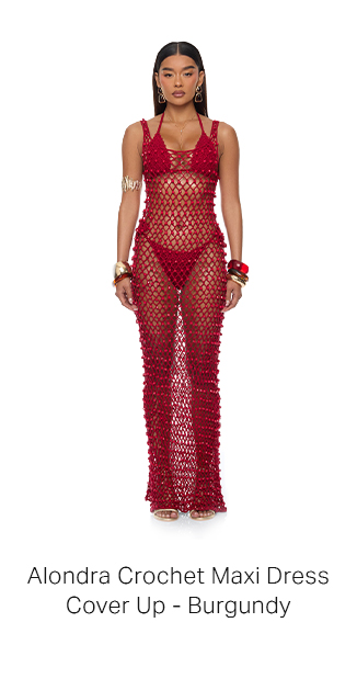 Woman models Alondra Burgundy Crochet Maxi Dress Cover Up with matching bikini, gold jewelry, and sandals, promoting beachwear style.