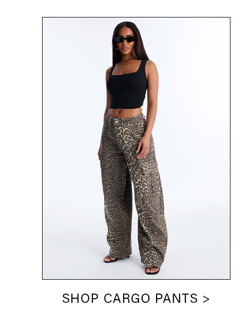 Stylish woman in a black square-neck crop top and trendy leopard print cargo pants. Shop the new collection of stylish cargo pants.