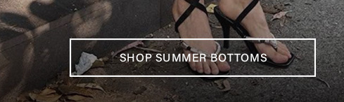 Black strappy high-heel sandals on pavement with "Shop Summer Bottoms" text overlay, linking to the trendy warm-weather fashion collection.