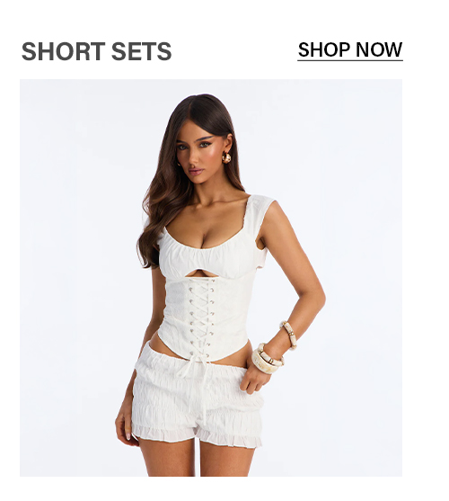 White lace-up corset top and matching ruched shorts set. Shop women's trendy short sets.
