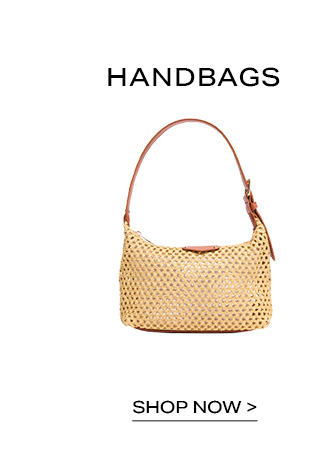 Woven straw shoulder bag with a brown leather strap under Handbags text, featuring a Shop Now call to action to shop the new category.