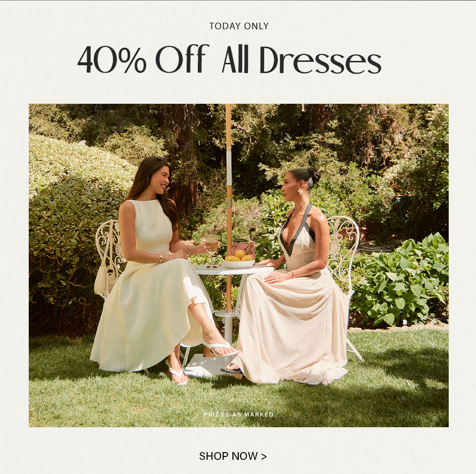 Elegant cream and beige tea party dresses shown on two women enjoying an outdoor garden gathering. Shop perfect formal attire.