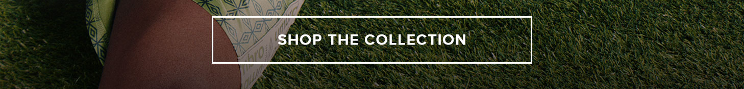 SHOP THE COLLECTION: Patterned apparel on person's leg on green grass. Find new summer styles now!