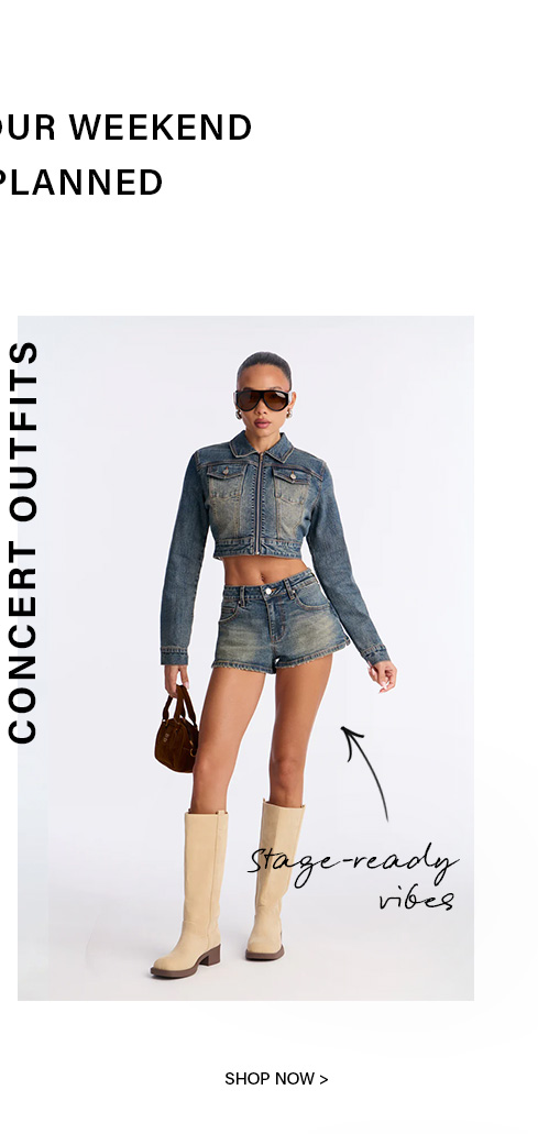 Stylish woman in faded denim cropped jacket, matching shorts, and beige knee-high boots. Shop our new concert outfits for stage-ready weekend fashion.