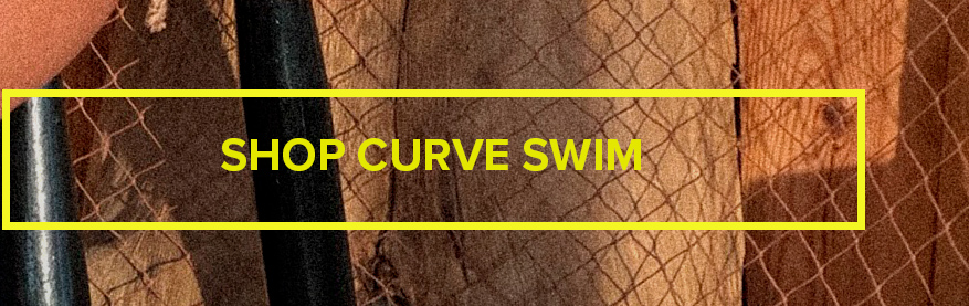 Yellow "Shop Curve Swim" promo banner on a rustic wooden and netting background, linking to the brand's plus size swimwear collection.