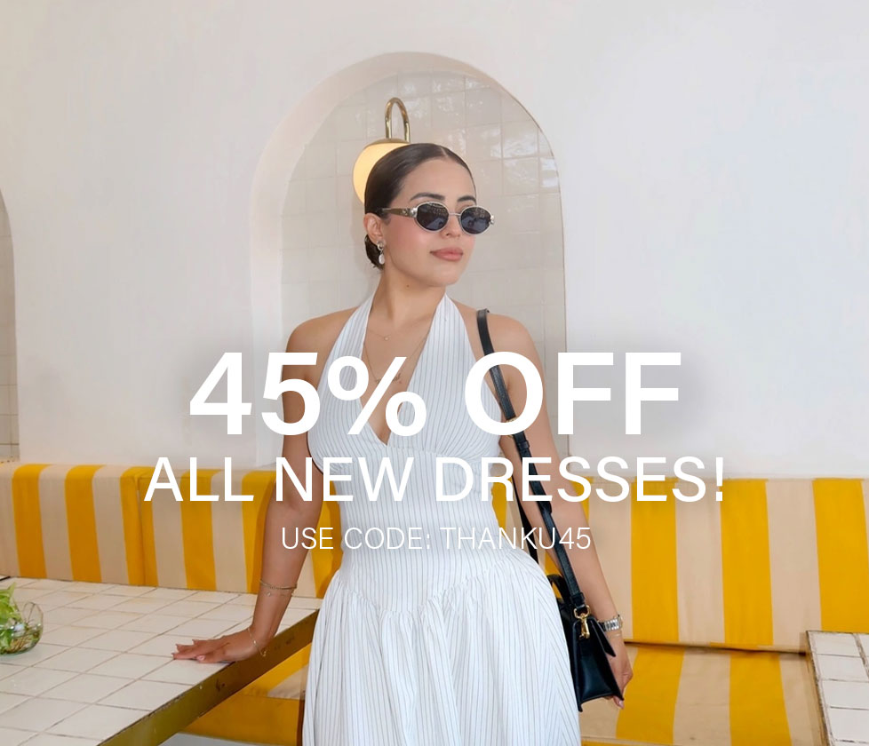 Model in white pinstripe halter dress promoting 45% off new spring & prom dresses with code THANKU45.