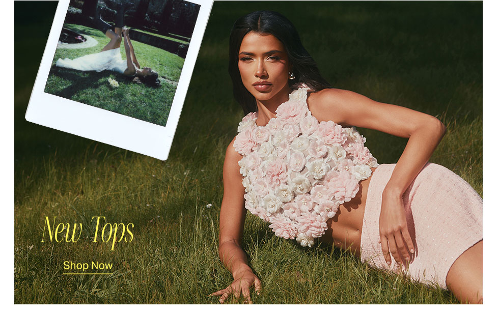 Stylish woman in a light pink floral textured crop top and skirt poses on green grass, showcasing new spring tops. Polaroid image of woman in white dress.