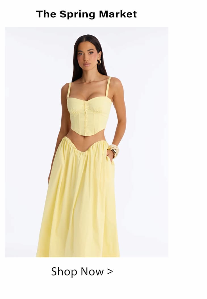 Woman in a light yellow two-piece spring outfit: a structured corset crop top and flowy maxi skirt. Shop The Spring Market's new arrivals.
