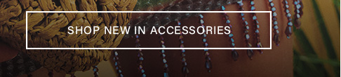 Close-up of a woven brown straw hat and beaded fringe with text reading "SHOP NEW IN ACCESSORIES" promoting the new seasonal accessories collection.
