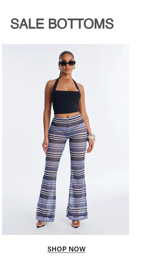 Stylish model in black halter crop top and blue, white, brown striped knit flare pants. Shop women's fashionable bottoms on sale.