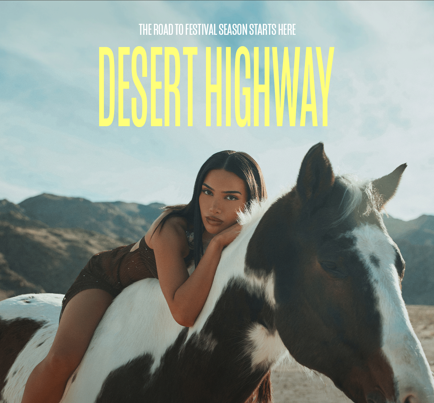 Stylish woman in a bronze top on a pinto horse against a desert backdrop. New Desert Highway collection for festival season.