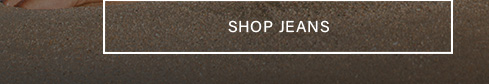 A white outlined button containing "SHOP JEANS." Click to explore our latest collection of quality jeans.