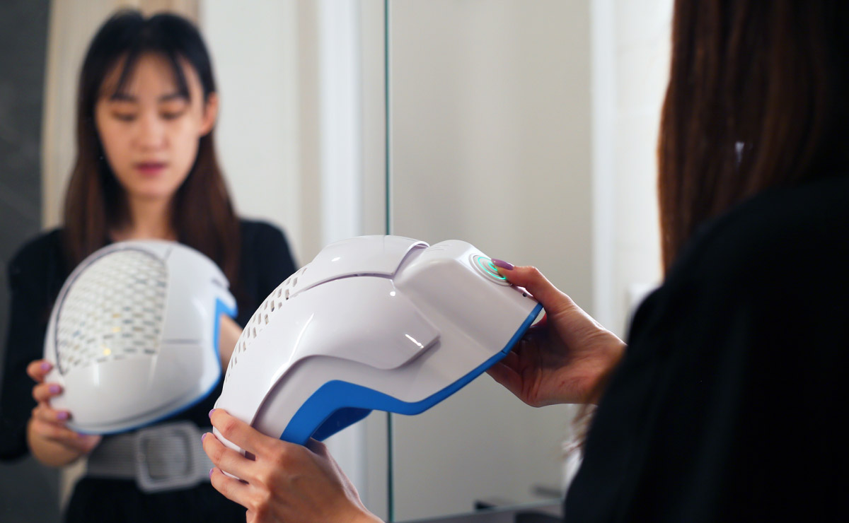 Woman turning on Theradome