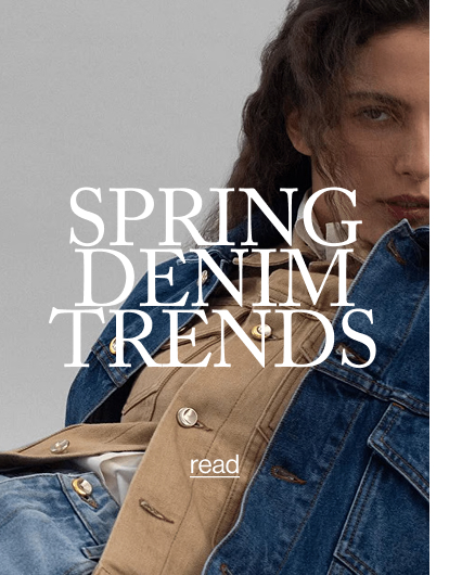 an image of a woman wearing a denim jacket and jeans