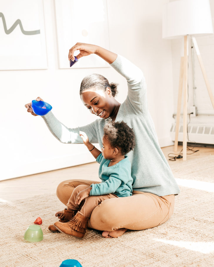 A parent reading aloud with a young child