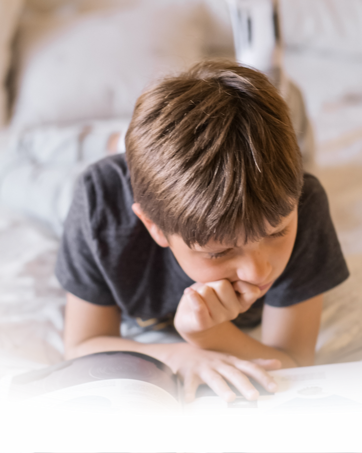 A parent reading aloud with a young child