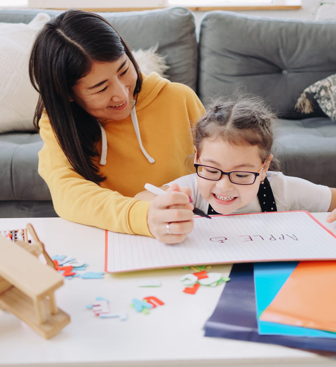A mother reading with her children at home