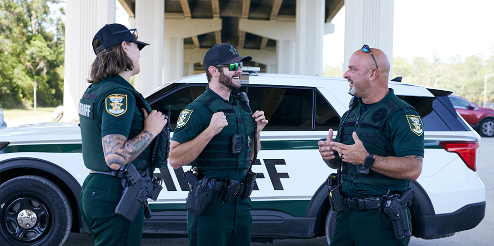 Officers gathered around eachother talking