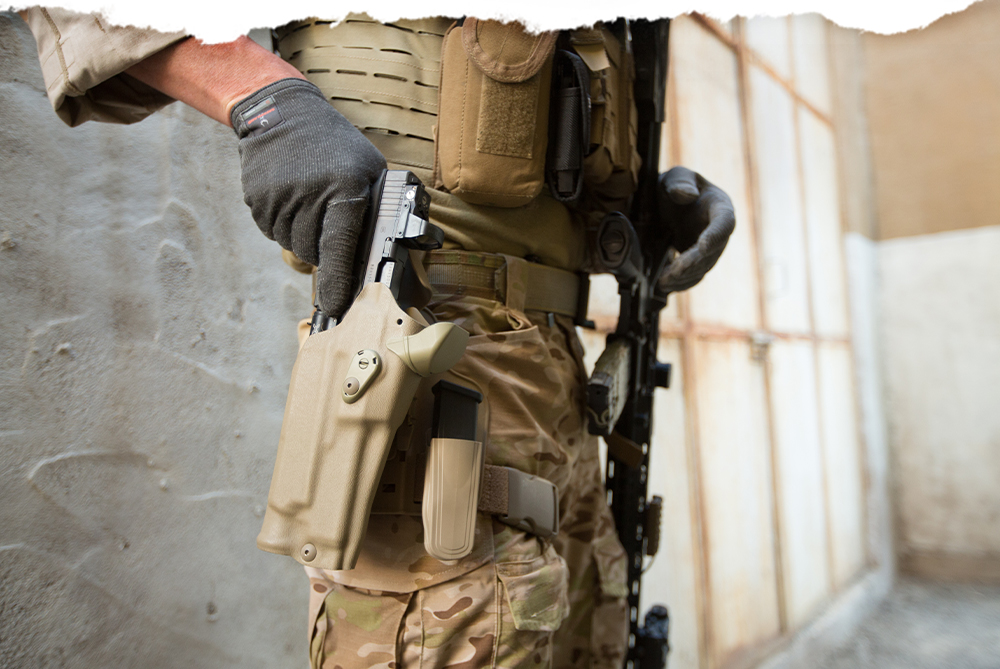 Military guy holstering Glock 22 Gen 5