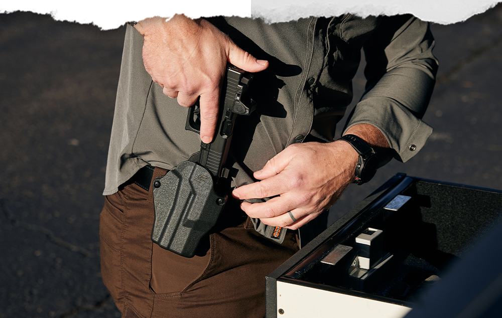 Glock 19 with an optic being holstered in Solis OWB holster