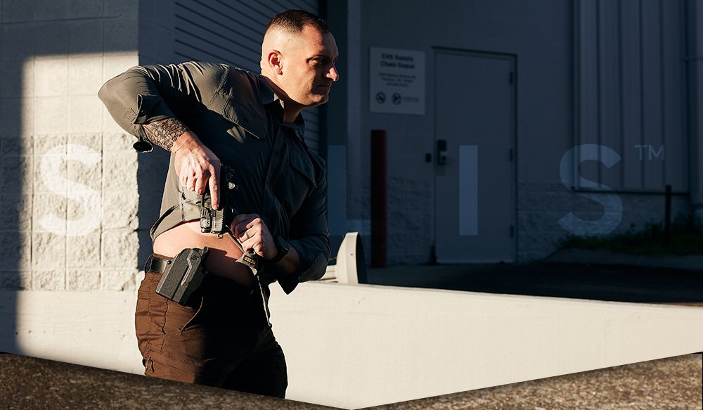 Gun being drawn from a Solis holster
