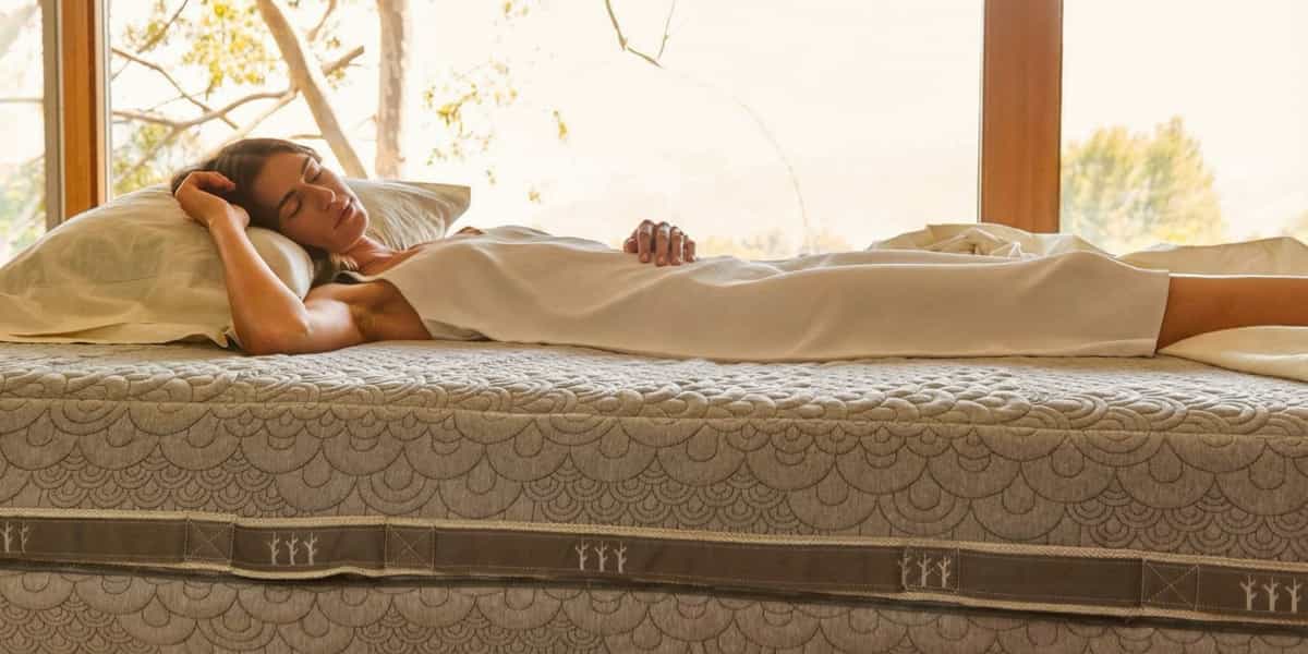 A women sleeping on the Crystal Cove Mattress