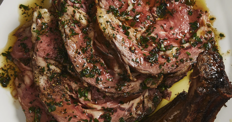 Low and slow rib roast, carved, with anchovy and rosemary
