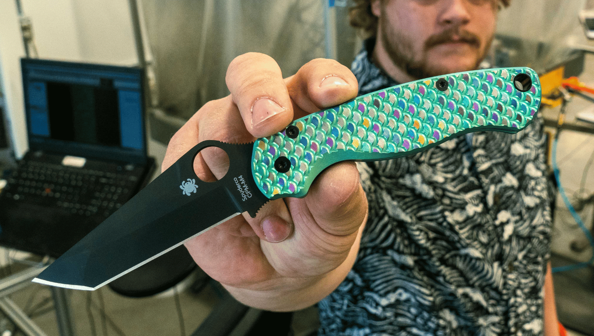 Andrew holding Paramilitary 2 knife with rainbow fish scales from Flytanium. Andrew holding Paramilitary 2 knife with rainbow fish scales from Flytanium.