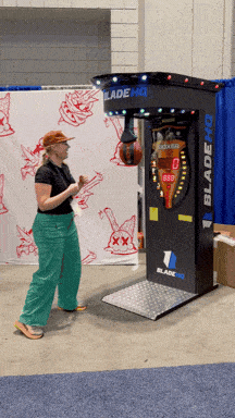 Flytanium team punching game at Blade Show.