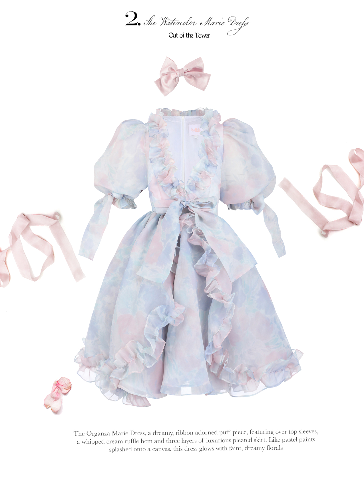 The Organza Marie Dress, a dreamy, ribbon adorned puff piece, featuring over top sleeves, a whipped cream ruffle hem and three layers of luxurious pleated skirt. Like pastel paints splashed onto a canvas, this dress glows with faint, dreamy florals.