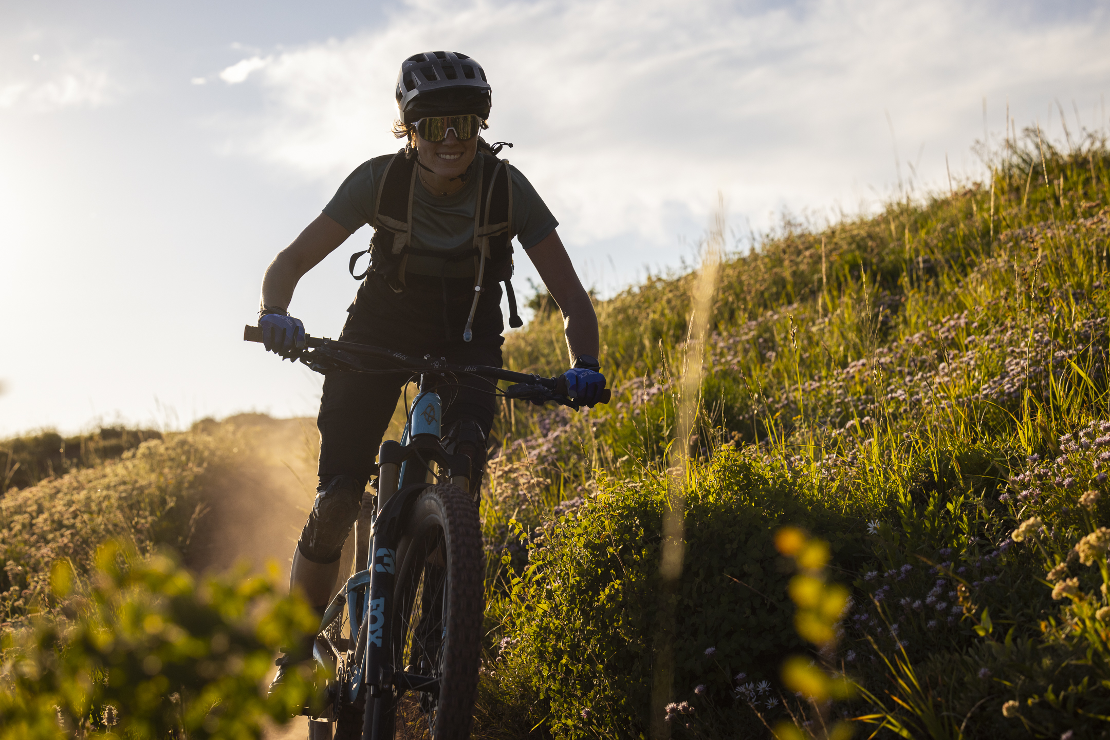 Mountain biker on a golden-hour singletrack