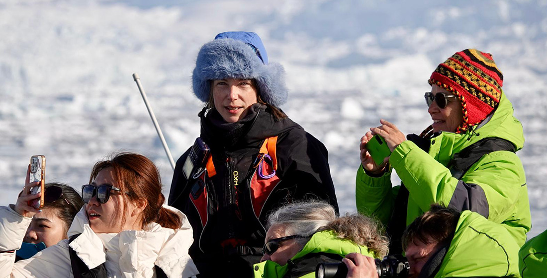 Atlas expedition leader guiding explorers in Antarctica